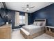 Comfortable bedroom with a ceiling fan, large window, and stylish furniture at 600 N Carriage Hill Dr # 1081, Las Vegas, NV 89138