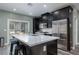 Modern kitchen with stainless steel appliances, a large island, and patio access at 600 N Carriage Hill Dr # 1081, Las Vegas, NV 89138