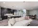 Comfortable living area leading to a modern kitchen, dining area and stairway at 600 N Carriage Hill Dr # 1081, Las Vegas, NV 89138