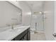Bright bathroom features a modern vanity and a glass-enclosed shower at 6110 Scarlet Leaf St, Las Vegas, NV 89148