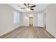 Bright bedroom with wood floors, ceiling fan, and closet at 6110 Scarlet Leaf St, Las Vegas, NV 89148