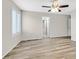 This bedroom features wood-look floors, ceiling fan, and a window with shutters at 6110 Scarlet Leaf St, Las Vegas, NV 89148