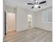 Bright bedroom featuring light hardwood floors and ample closet space at 6110 Scarlet Leaf St, Las Vegas, NV 89148