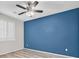 Bright bedroom featuring a ceiling fan, neutral walls and hardwood floors at 6110 Scarlet Leaf St, Las Vegas, NV 89148