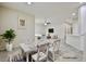 Bright dining room with stylish decor, table setting, and access to other living spaces at 6110 Scarlet Leaf St, Las Vegas, NV 89148