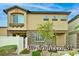Inviting two-story home featuring stone accents and a well-manicured front yard at 6110 Scarlet Leaf St, Las Vegas, NV 89148