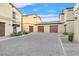 Exterior of home shows garages and stamped brick driveway at 6110 Scarlet Leaf St, Las Vegas, NV 89148