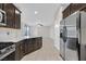 Modern kitchen with a center island, sleek appliances, and an open view to the living area at 6110 Scarlet Leaf St, Las Vegas, NV 89148