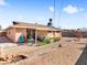 Large backyard featuring a covered patio, barbecue area, and minimal landscaping at 6117 Borden Cir, Las Vegas, NV 89107