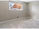 Bright bedroom featuring large window, tile flooring and neutral paint color at 6117 Borden Cir, Las Vegas, NV 89107
