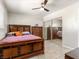 Bedroom with a bed, dresser, sliding closet doors, and tile flooring at 6117 Borden Cir, Las Vegas, NV 89107