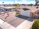Aerial view of a single-story home with a brick driveway, a lawn, and a two-car garage at 6117 Borden Cir, Las Vegas, NV 89107