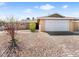 Charming single-story home with low maintenance desert landscaping and a two-car garage at 6117 Borden Cir, Las Vegas, NV 89107