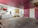 Spacious garage area with washer, dryer, ample storage and easy access to the outside at 6117 Borden Cir, Las Vegas, NV 89107