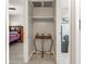 Neutral hall closet with a small table and an upper shelf at 6117 Borden Cir, Las Vegas, NV 89107