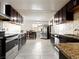 Contemporary kitchen with sleek countertops, stainless steel appliances, and abundant cabinet space at 6117 Borden Cir, Las Vegas, NV 89107