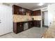 The kitchen features stylish cabinets, tiled backsplash, stainless steel appliances and granite countertops at 6117 Borden Cir, Las Vegas, NV 89107