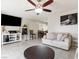 Cozy living room featuring tile flooring, ceiling fan and modern furniture at 6117 Borden Cir, Las Vegas, NV 89107