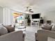 Open living room with sliding glass doors, tile flooring, and comfortable seating at 6117 Borden Cir, Las Vegas, NV 89107