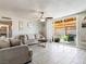 The living room features tile floors, neutral walls, and a sliding glass door to the backyard at 6117 Borden Cir, Las Vegas, NV 89107