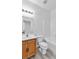 Bathroom featuring a double sink vanity with wood cabinets, tub, shower and bright lighting at 6329 Sandy Ridge St # 1, North Las Vegas, NV 89081