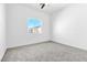Bright bedroom with carpeted floors and a window at 6329 Sandy Ridge St # 1, North Las Vegas, NV 89081