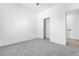 Bedroom featuring carpeted floors, neutral walls, closet and bright lighting at 6329 Sandy Ridge St # 1, North Las Vegas, NV 89081