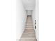 Inviting entryway with wood-look floors leading up to the main level of the home at 6329 Sandy Ridge St # 1, North Las Vegas, NV 89081