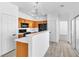 Kitchen boasts wooden cabinets, black appliances, and white countertops at 6329 Sandy Ridge St # 1, North Las Vegas, NV 89081