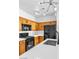 Stylish kitchen features wooden cabinets and stainless appliances at 6329 Sandy Ridge St # 1, North Las Vegas, NV 89081