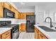 Charming kitchen features wooden cabinets, and stainless appliances at 6329 Sandy Ridge St # 1, North Las Vegas, NV 89081