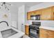 Lovely kitchen with wooden cabinets, modern appliances, and white countertop at 6329 Sandy Ridge St # 1, North Las Vegas, NV 89081