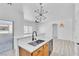 Bright kitchen features stainless sink, white countertop and wooden cabinets at 6329 Sandy Ridge St # 1, North Las Vegas, NV 89081