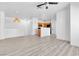 Bright and airy living room with modern fixtures and luxury vinyl plank flooring at 6329 Sandy Ridge St # 1, North Las Vegas, NV 89081