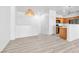 Open-concept living area with wood-look floors seamlessly flowing through the main level at 6329 Sandy Ridge St # 1, North Las Vegas, NV 89081