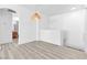 Stylish loft space with wood-look floors and modern lighting fixtures at 6329 Sandy Ridge St # 1, North Las Vegas, NV 89081
