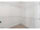 Walk-in closet with white shelving and carpet flooring at 6329 Sandy Ridge St # 1, North Las Vegas, NV 89081