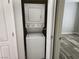 Compact, stacked washer and dryer, laundry area next to a room at 7200 Pirates Cove Rd # 1014, Las Vegas, NV 89145