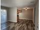 Bright living space with wood-look flooring, dining area, and sliding glass doors at 7200 Pirates Cove Rd # 1014, Las Vegas, NV 89145