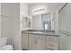 Modern bathroom with a granite vanity, a white sink, a shower and a toilet at 7456 Cooks Meadow St, North Las Vegas, NV 89084