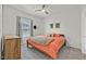 Cozy bedroom features carpet floors, ceiling fan, neutral walls and a dresser at 7456 Cooks Meadow St, North Las Vegas, NV 89084