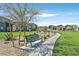 Enjoy community park bench and walkway surrounded by greenery, enhancing the neighborhood's charm at 7456 Cooks Meadow St, North Las Vegas, NV 89084