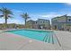 Enjoy the community pool, surrounded by lush palm trees providing a refreshing escape at 7456 Cooks Meadow St, North Las Vegas, NV 89084