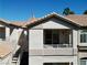 Condo exterior showcasing a private balcony, stairs to entrance, and neutral stucco finish at 75 N Valle Verde Dr # 1822, Henderson, NV 89074