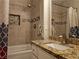 Bathroom with updated granite countertop, tiled walls, shower, and decorative mosaic tile inset at 75 N Valle Verde Dr # 1822, Henderson, NV 89074