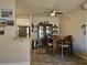 Dining area with wood table set and stainless steel refrigerator, adjacent to the kitchen at 75 N Valle Verde Dr # 1822, Henderson, NV 89074