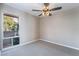 Bright bedroom with large window with beautiful light and a decorative ceiling fan at 778 Oakmont Ave # 312, Las Vegas, NV 89109