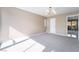 Bedroom featuring neutral carpet and paint with natural light streaming through the windows at 778 Oakmont Ave # 312, Las Vegas, NV 89109