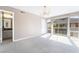 Bright bedroom featuring neutral carpet, paint, and access to an ensuite bathroom at 778 Oakmont Ave # 312, Las Vegas, NV 89109