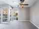 Bright living room with large windows offers great natural light and a decorative ceiling fan at 778 Oakmont Ave # 312, Las Vegas, NV 89109